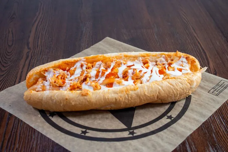Buffalo Chicken cheesesteak — chicken, mozzarella, grilled onions, buffalo sauce and ranch on top