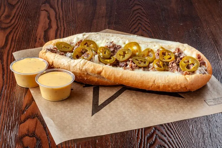 Texican cheesesteak — beef, mozzarella, jalapenos with queso on the side